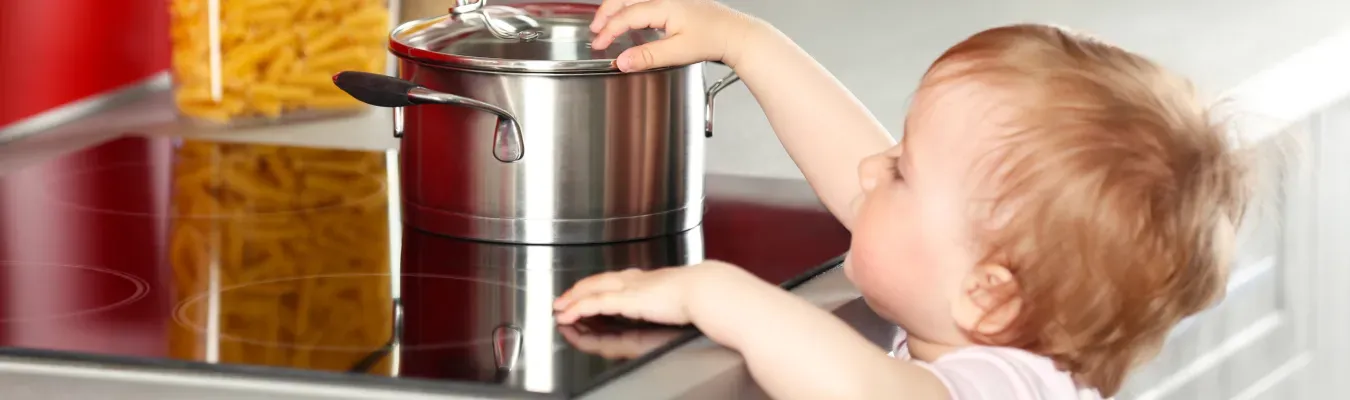 kid-reaching-for-pot-stove